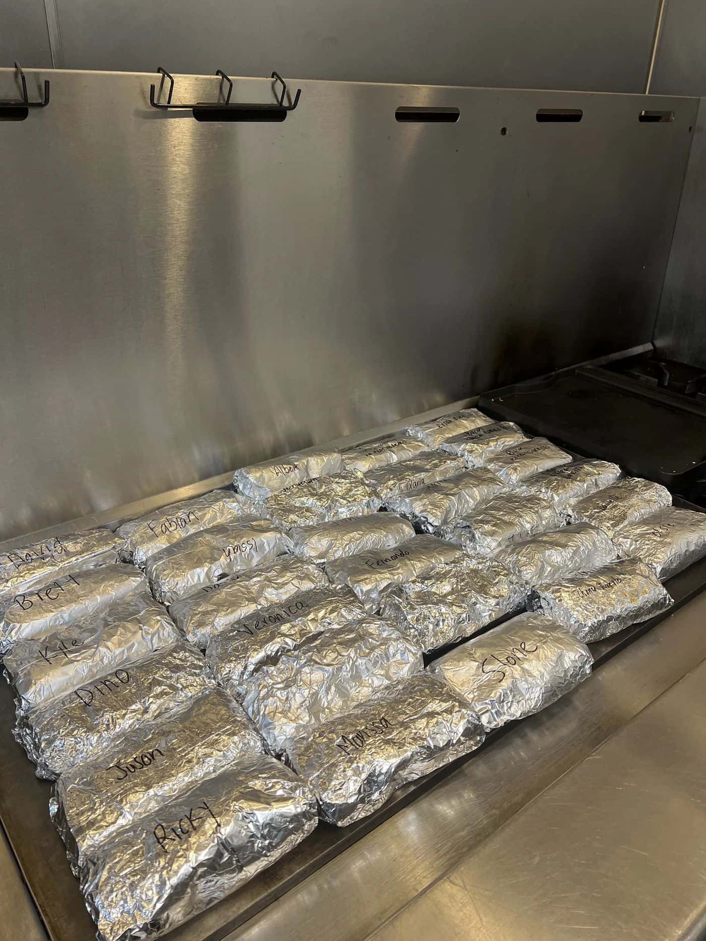 Tray of foil-wrapped burritos prepared for a Las Vegas corporate lunch